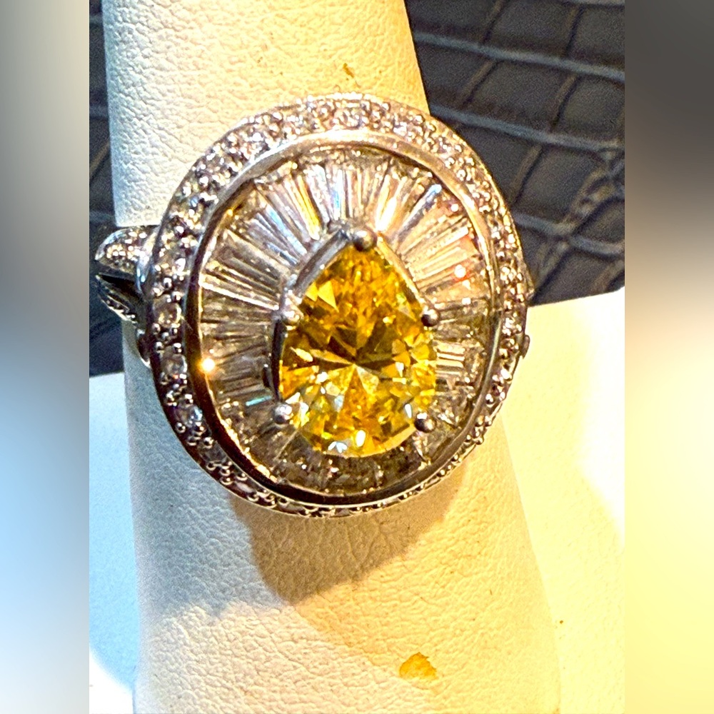 Yellow pear shape diamond and baguettes